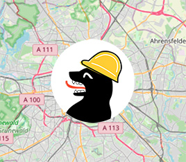  The logo of Hier Baut Berlin, a berlin bear with a construction hat, in front of the berlin map 