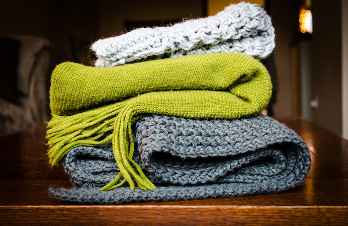  A pile of blankets on a table 