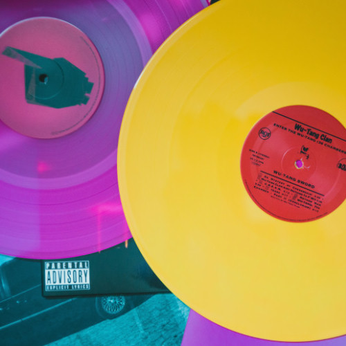 Two colorful vinyl LPs, one deep purple, the other bright yellow. You see the 